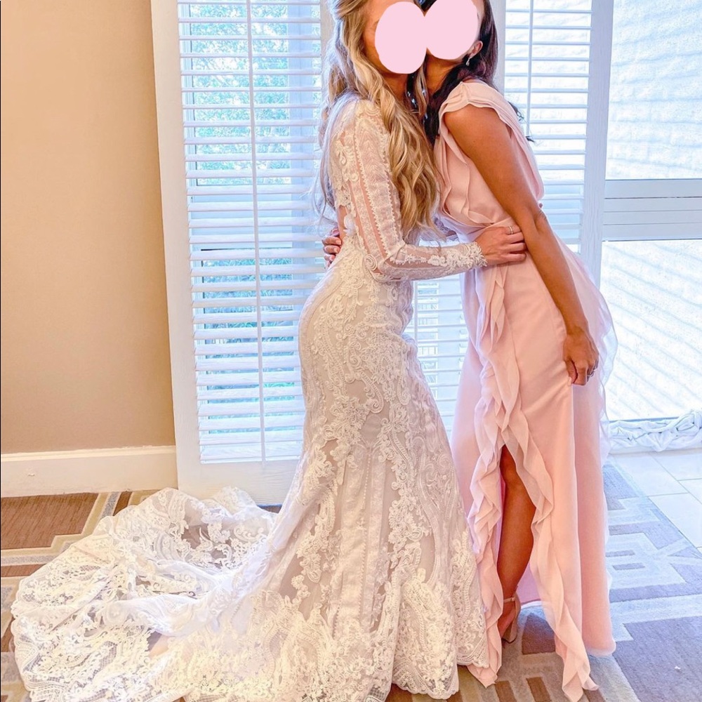 Light pink bridesmaids dress from David’s Bridal. Brand White by Vera Wang